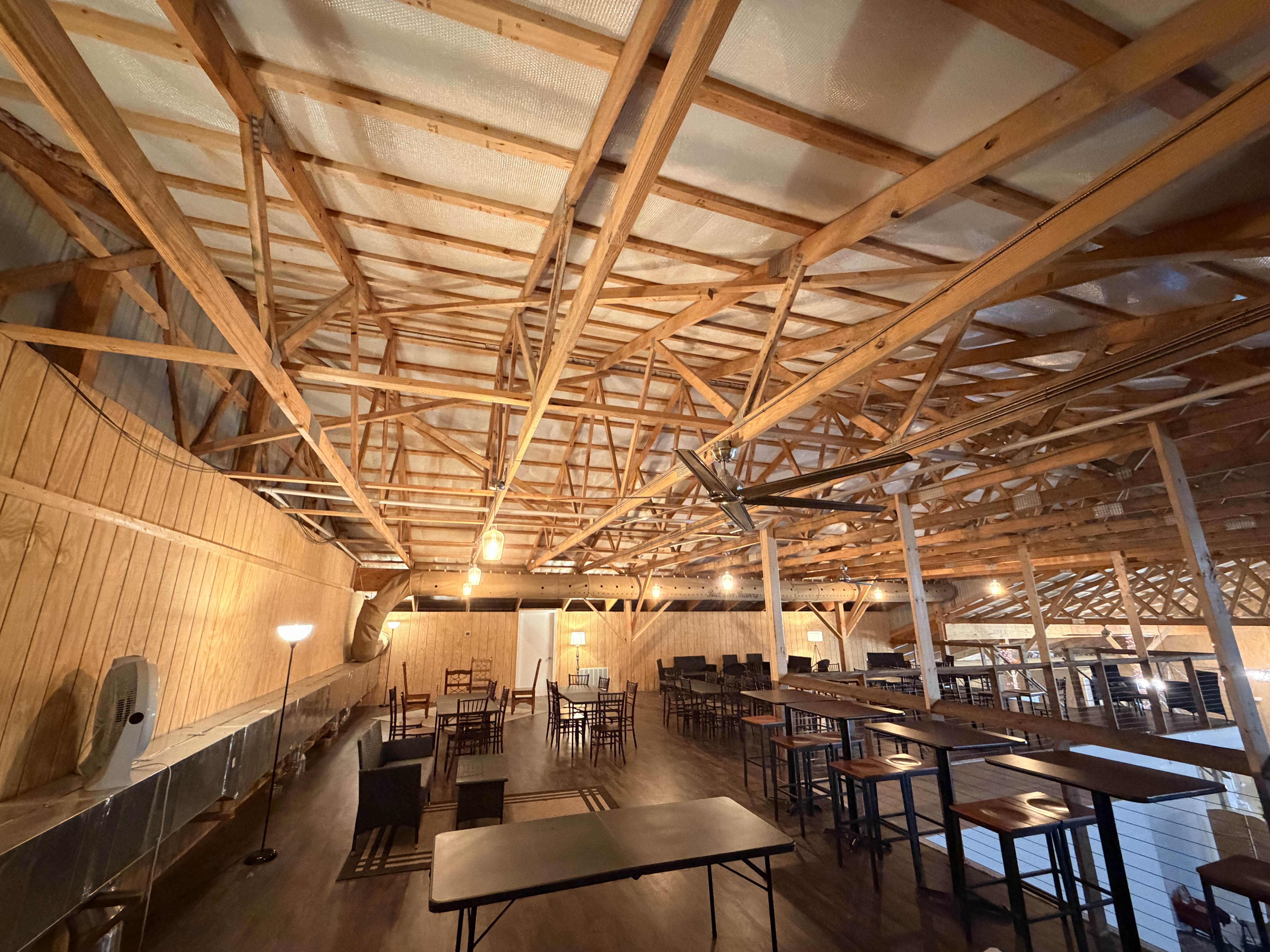 The Big Barn event venue interior at Backroom Brewery — exposed timber trusses