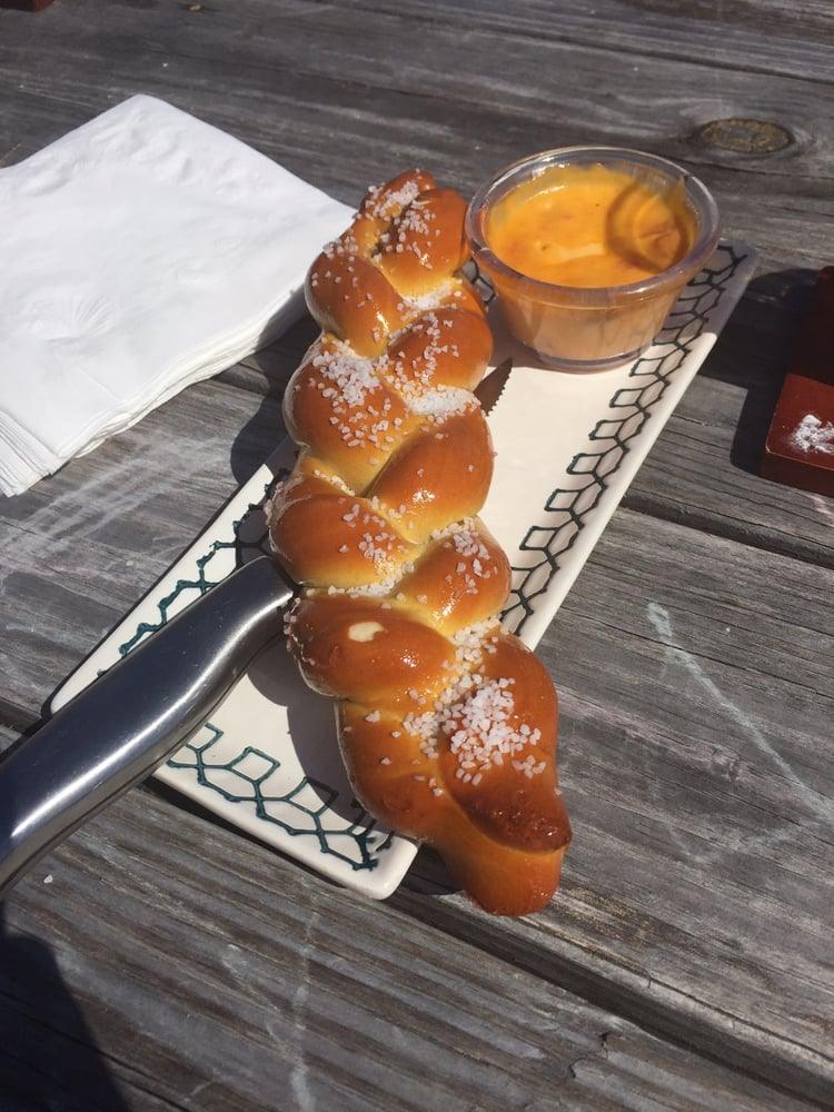 A braided soft pretzel with beer cheese