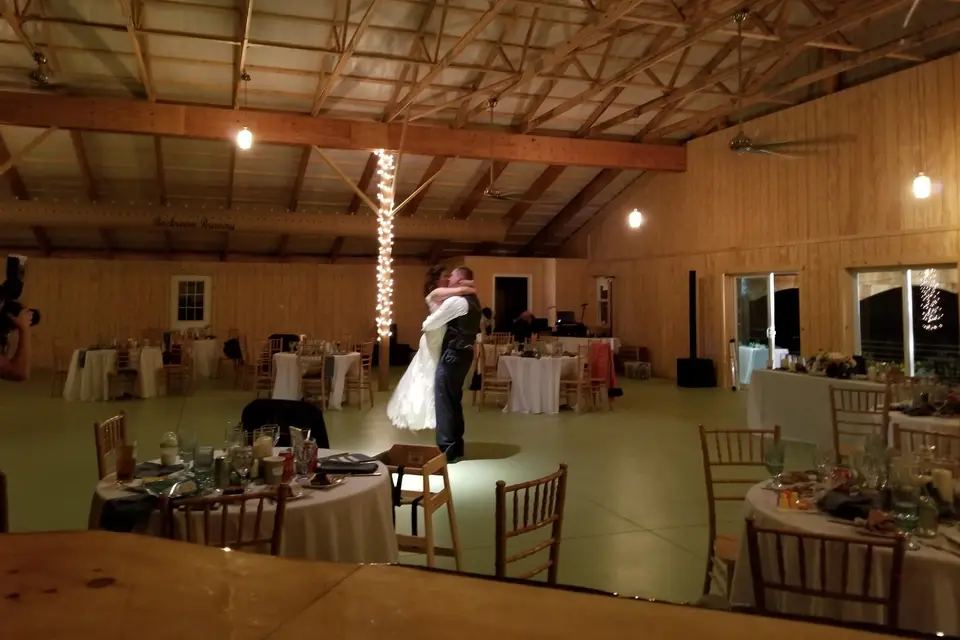 A celebration underway in the barn at night