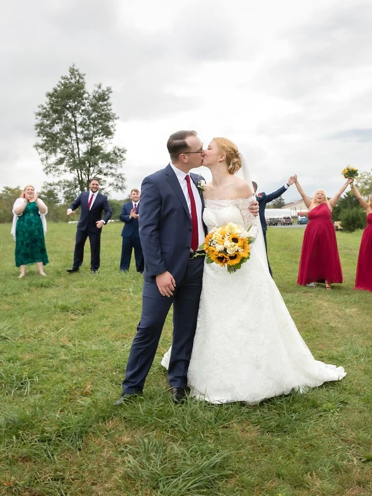 A newlywed kiss on the lawn