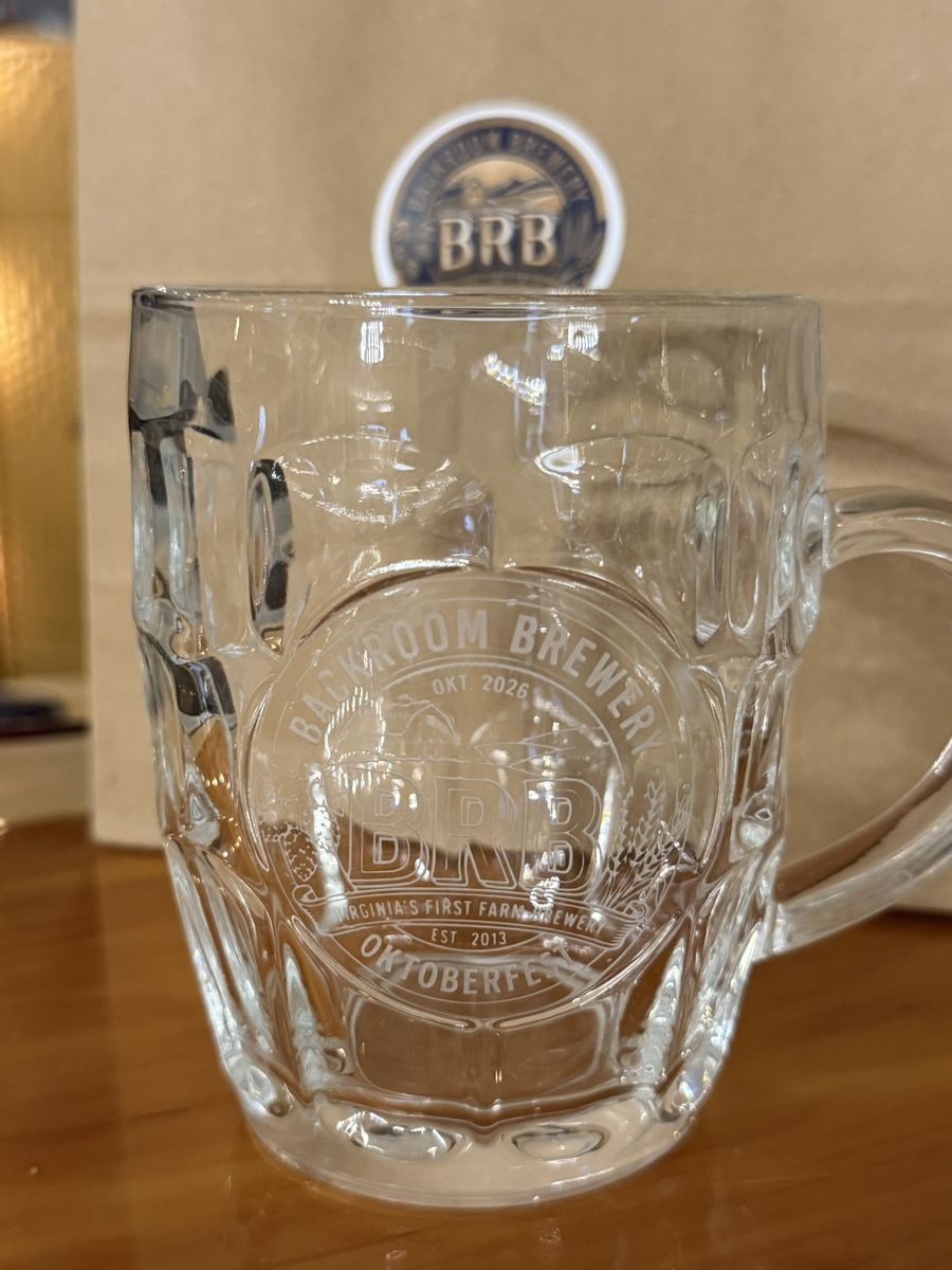 A dimpled glass mug etched with the Backroom Brewery logo and Oktoberfest 2026