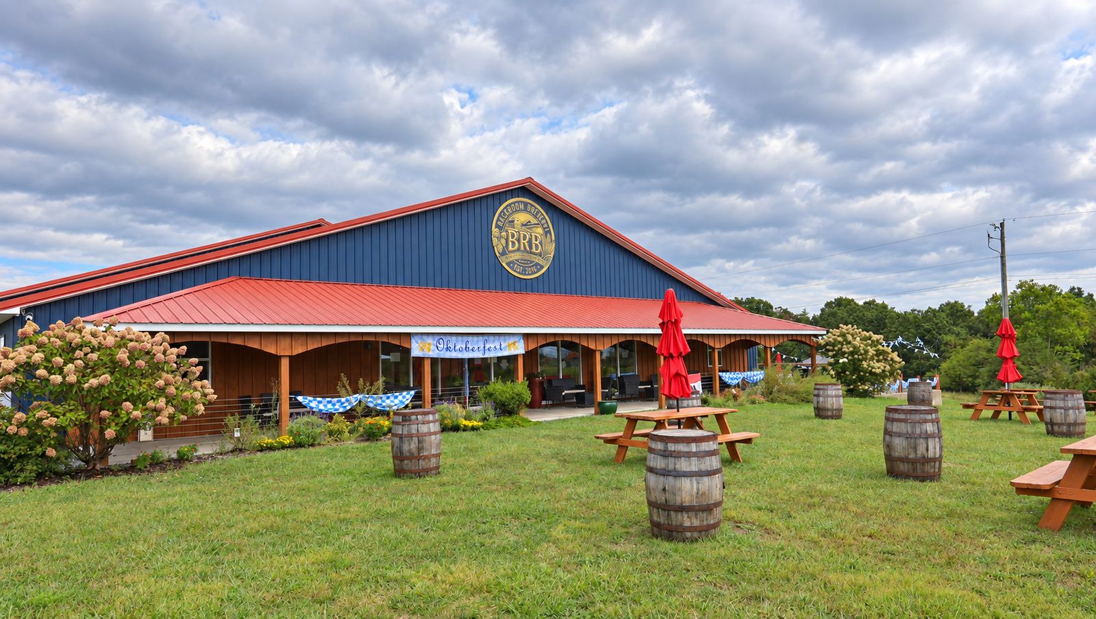 The Backroom Brewery barn with an Oktoberfest banner over the porch and blue-and-white bunting along the rail
