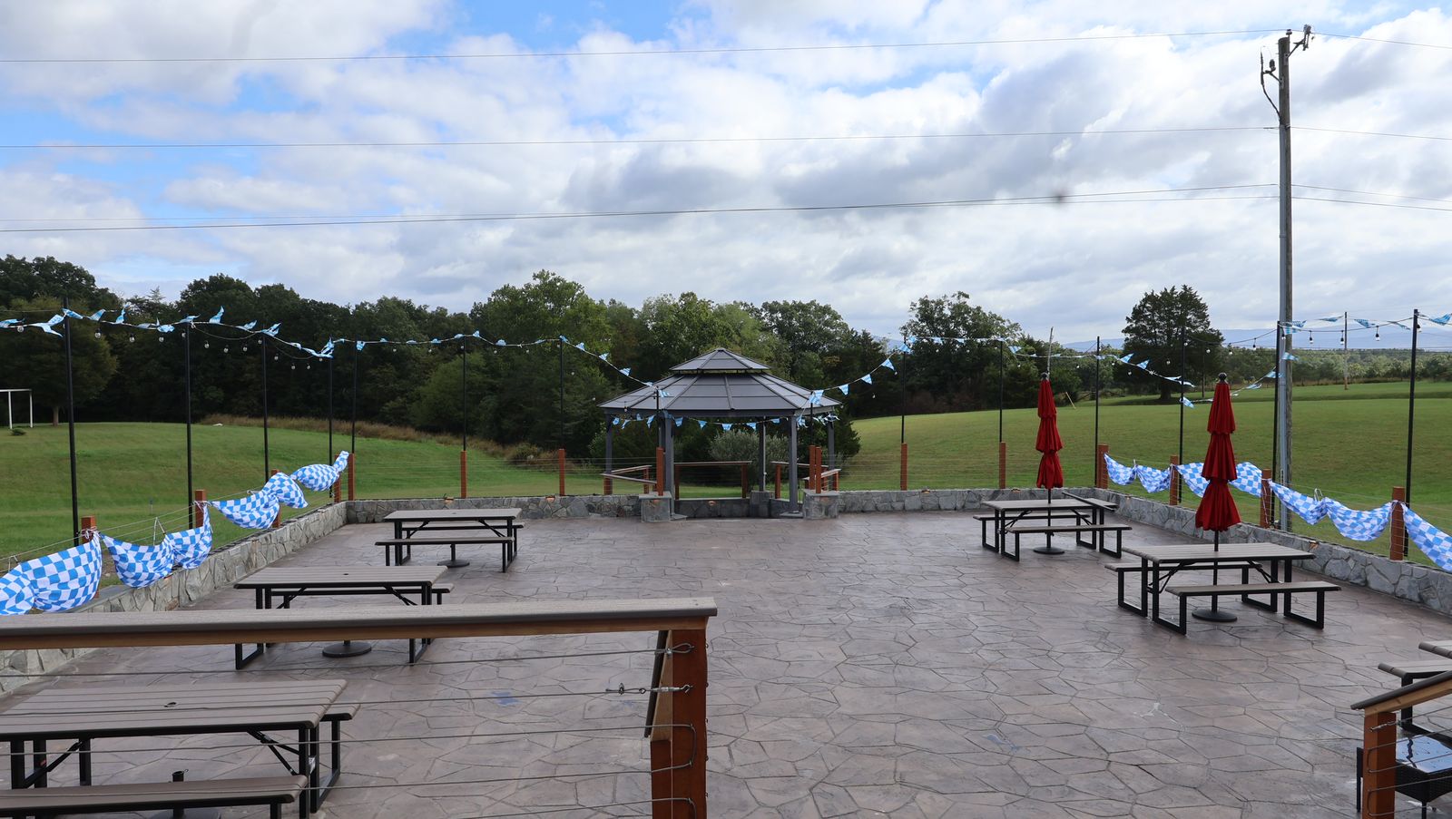 The stone patio and gazebo strung with blue-and-white Bavarian bunting